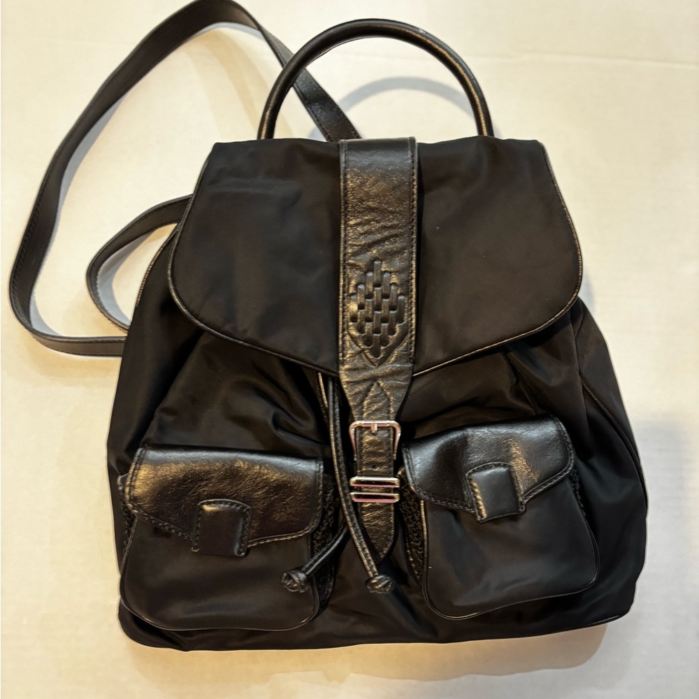 Cole Haan Backpack!Black ladies bagw/mixed material detail.UsedGoodVryCondition